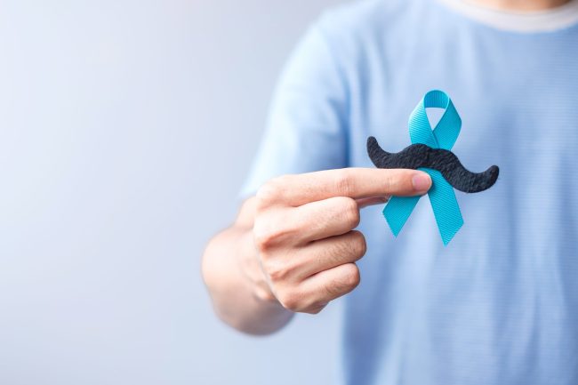 November Prostate Cancer Awareness month, Blue Ribbon with musta